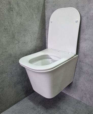 Унитаз подвесной CeramaLux 2622E белый с сиденьем микролифт каскадный смыв